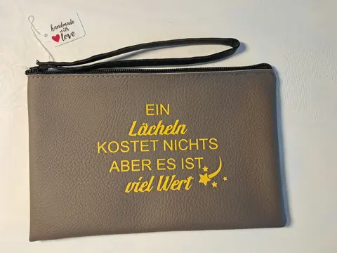 Handgelenktasche mit inspirierendem Spruch